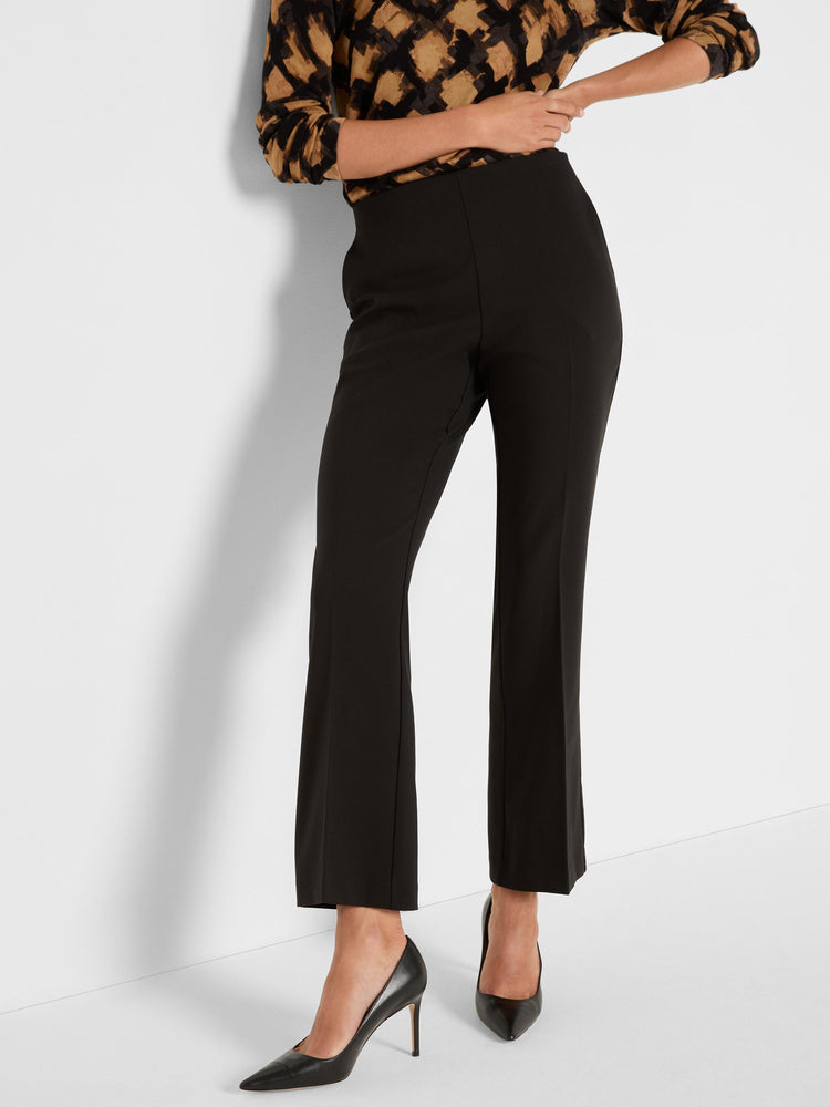 These high-waisted black tailored pants feature a slimming fit, cropped straight leg silhouette, and prominent front leg.