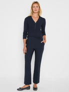 Dark navy demi boot pants with a smooth appearance and visible front leg crease.