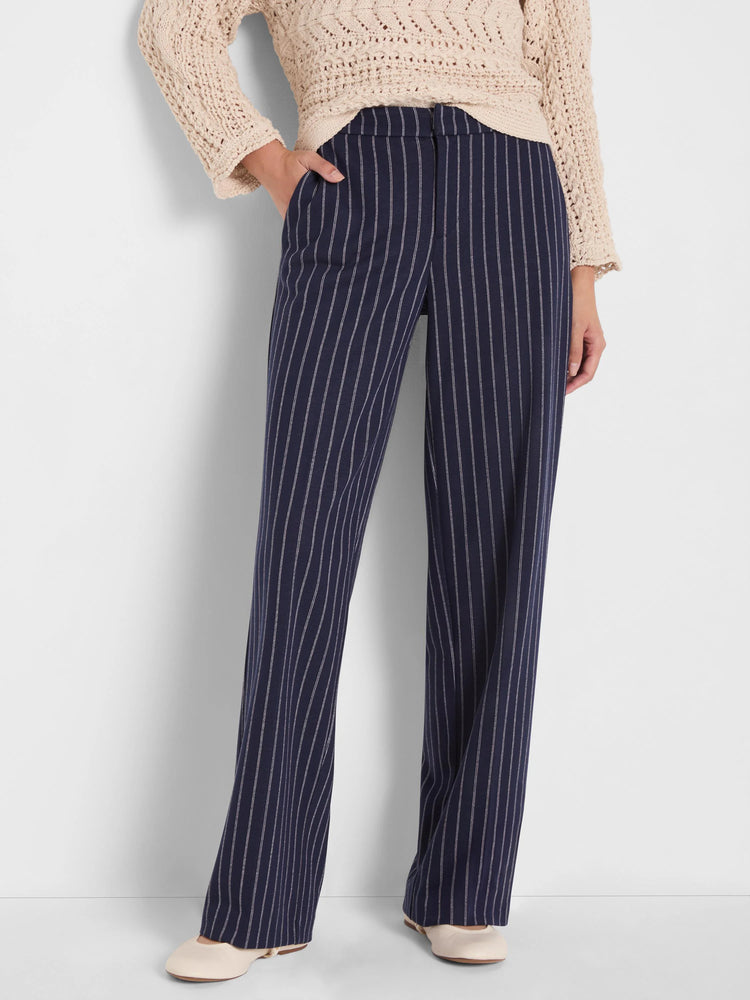 Navy wide-leg knit pants with fine white pinstripes, featuring slip pockets.