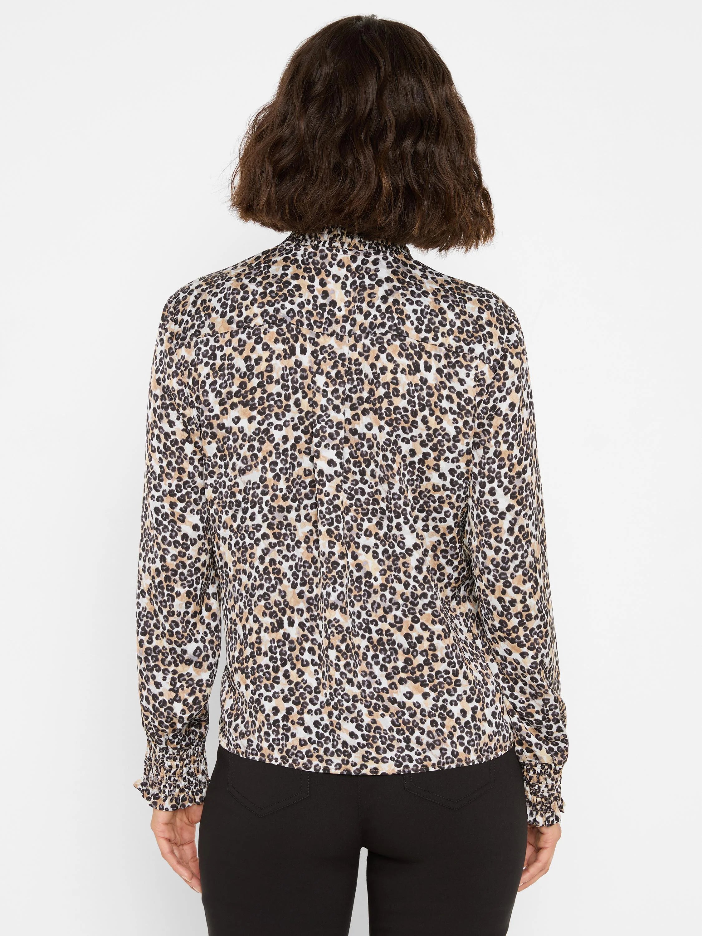 Leopard print top: cream, tan, dark brown spots. Long sleeves, high neck, smocked cuffs.