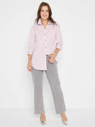 Light pink button-down shirt with thin vertical stripes and scattered subtle shine.