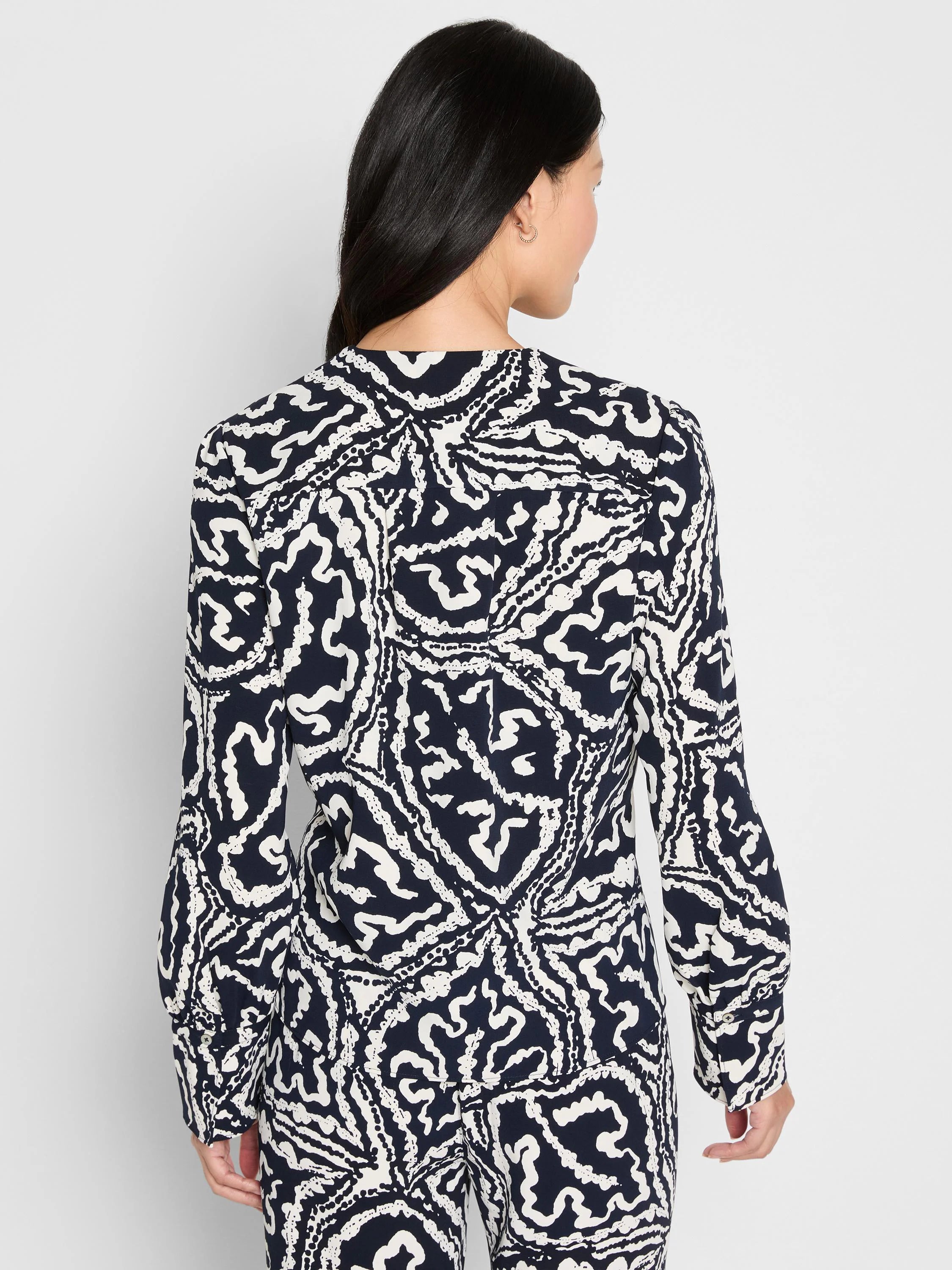 Indigo Leaf Double Crepe Top: Long-sleeved, indigo with an abstract white leaf pattern and button cuffs.