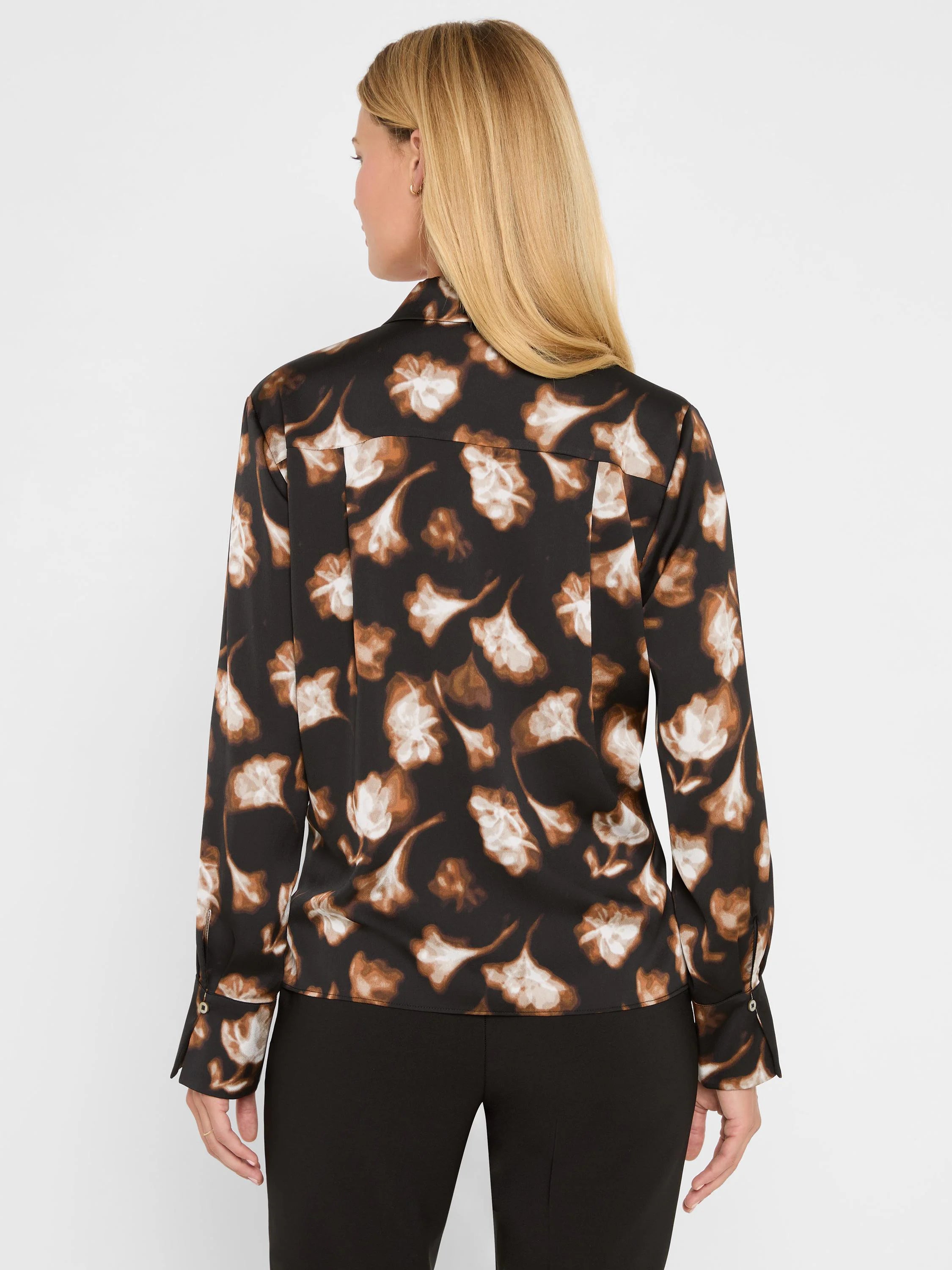 Black popover shirt with golden-brown and cream stylized ginkgo leaf pattern, shown on model's back.