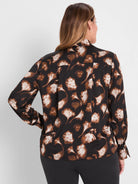 Black shirt with cream & brown ginkgo leaf pattern, long sleeves, and back pleat.