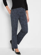 Dark blue straight ankle jeans with an all-over black leopard print.