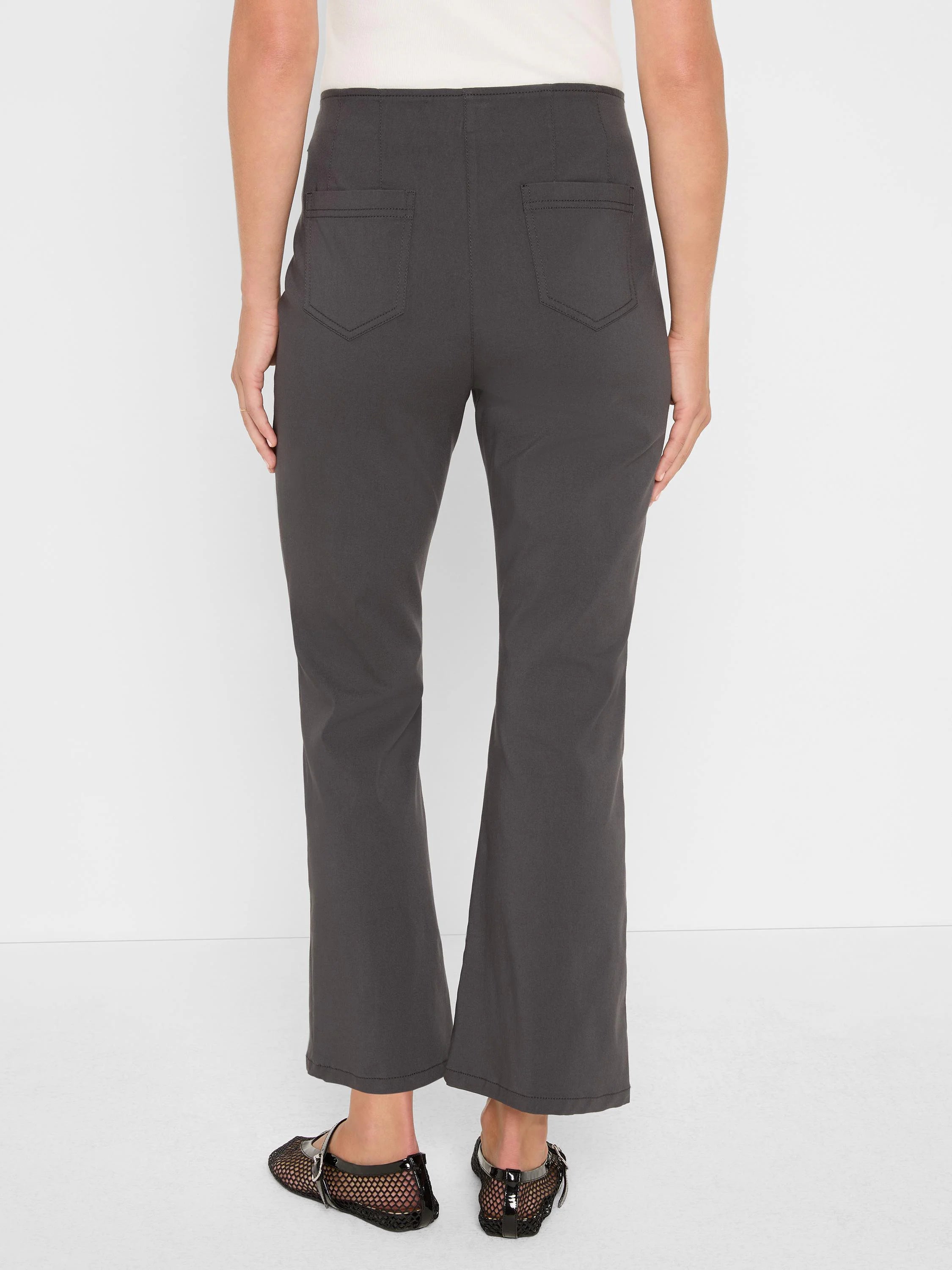 Charcoal bootcut pants, cropped length. Two back patch pockets with visible stitching.