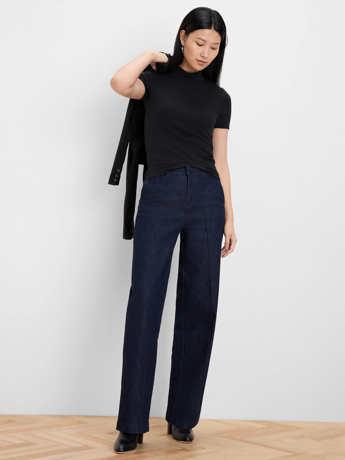 Black, short-sleeve rib knit mockneck top.