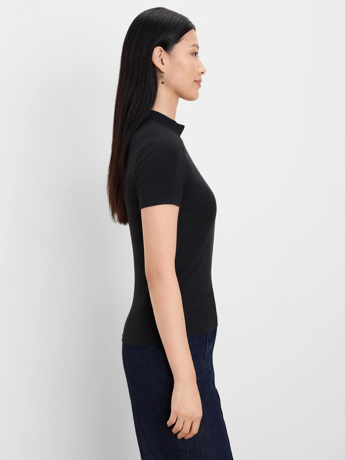 Black rib knit short sleeve mockneck top.