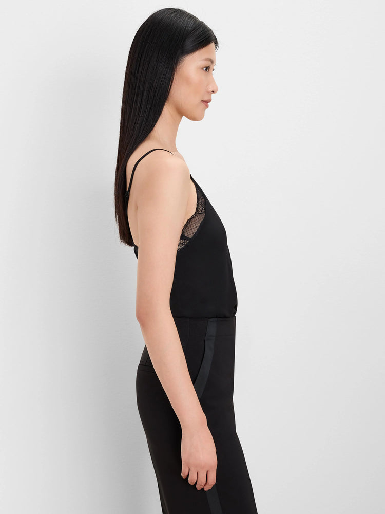 Black knit cami with spaghetti straps and matching black lace trim at the bust, worn by a model.
