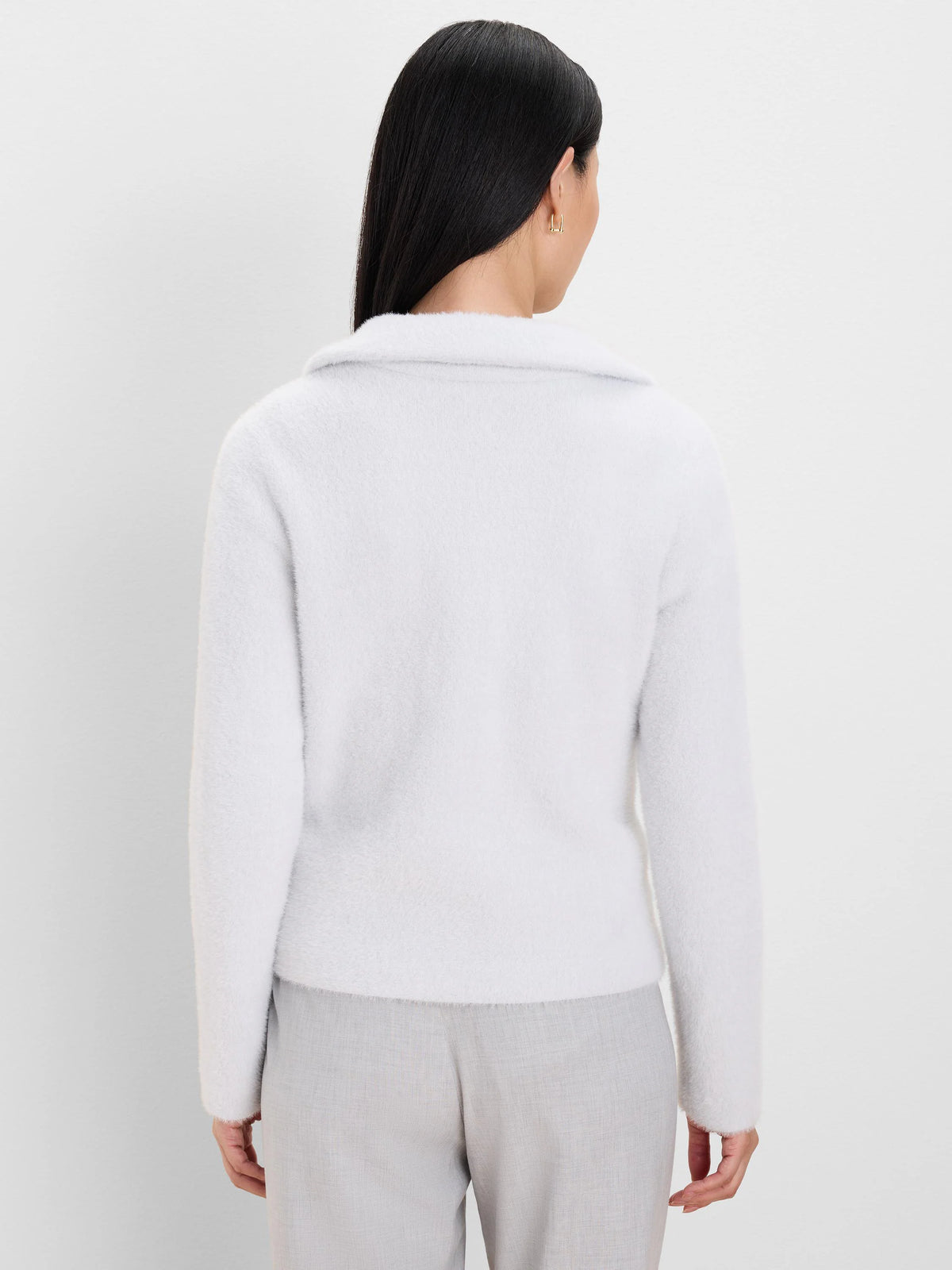 Light grey fuzzy jacket, back view. Features a collar and long sleeves.