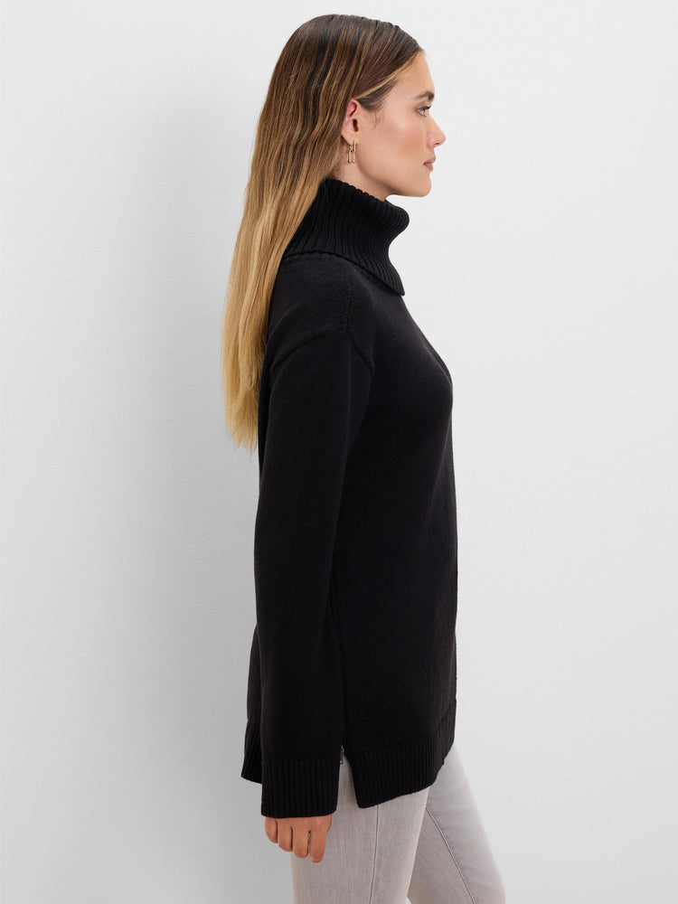 Black long-sleeve sweater with foldover turtleneck, ribbed cuffs, and a side zipper near the hem.