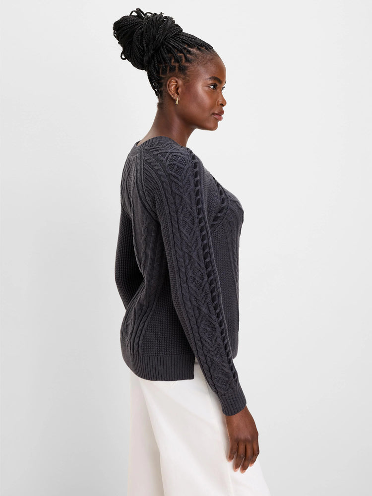 Charcoal gray patchwork cable knit sweater with varied braided patterns on sleeves and body.