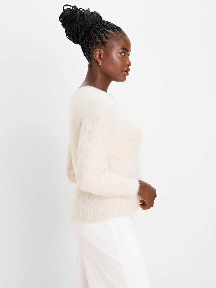 Light cream, fuzzy sweater with a subtle diagonal knit pattern and ribbed details.