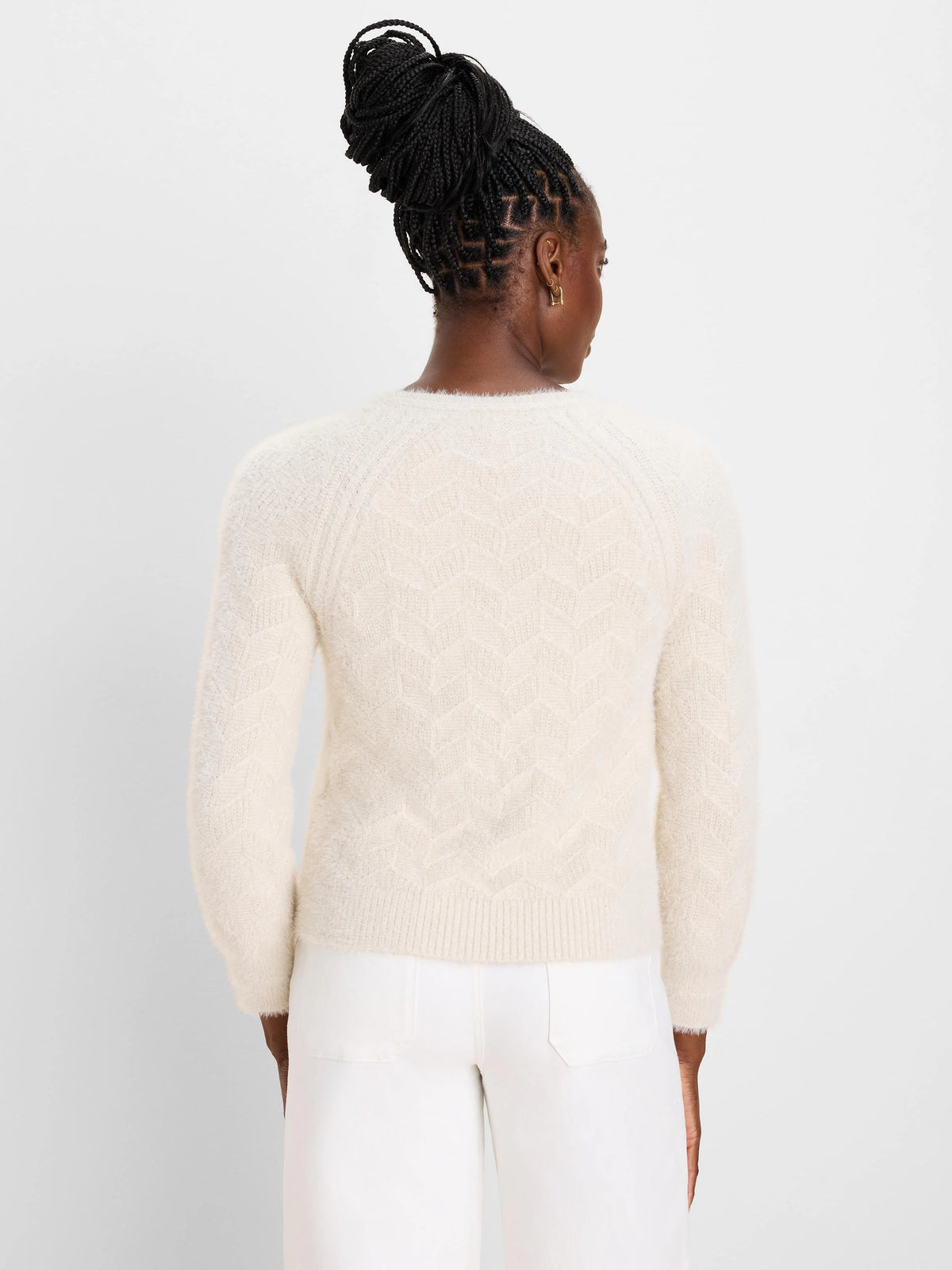 Cream, fuzzy sweater with an all-over chevron knit pattern.