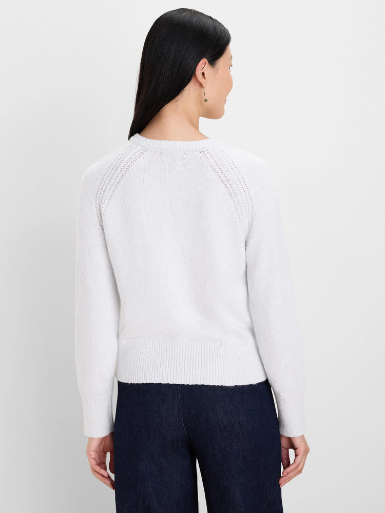 Pale grey Whisp Sweater on model, back view. Delicate open-knit raglan seams, ribbed cuffs & hem.