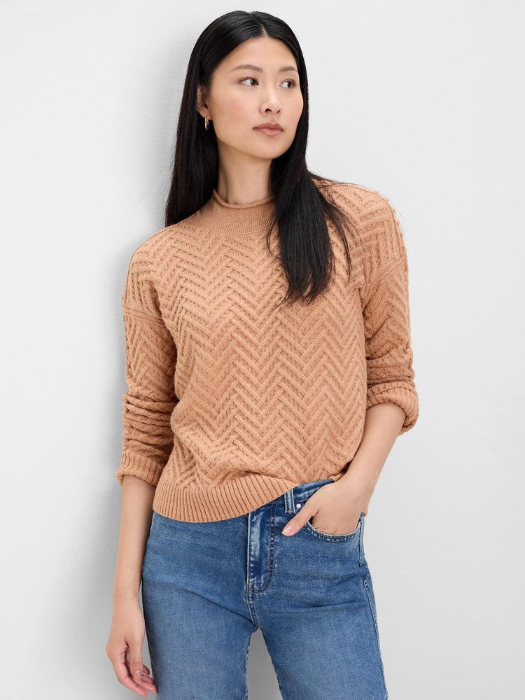 Tan roll neck sweater with chevron weave, ribbed collar, cuffs, and hem.