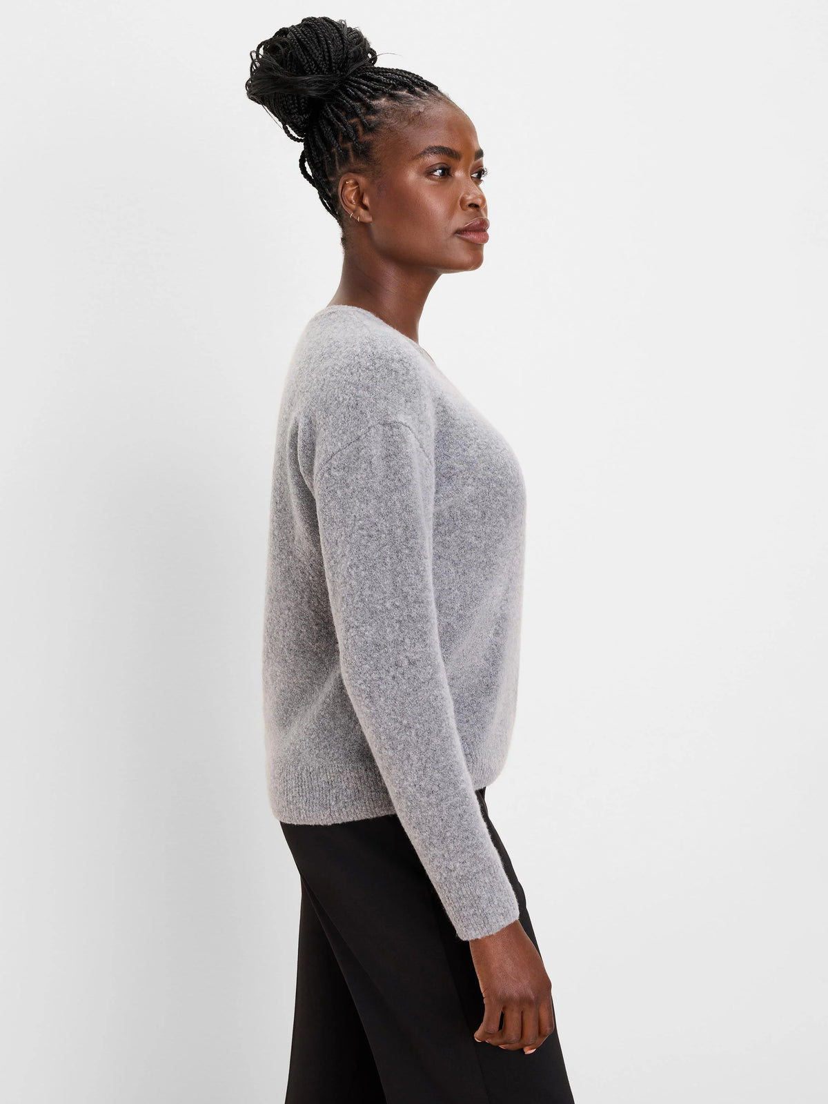 Light grey slouchy scoop neck sweater with a soft, fuzzy knit texture, worn by a model.