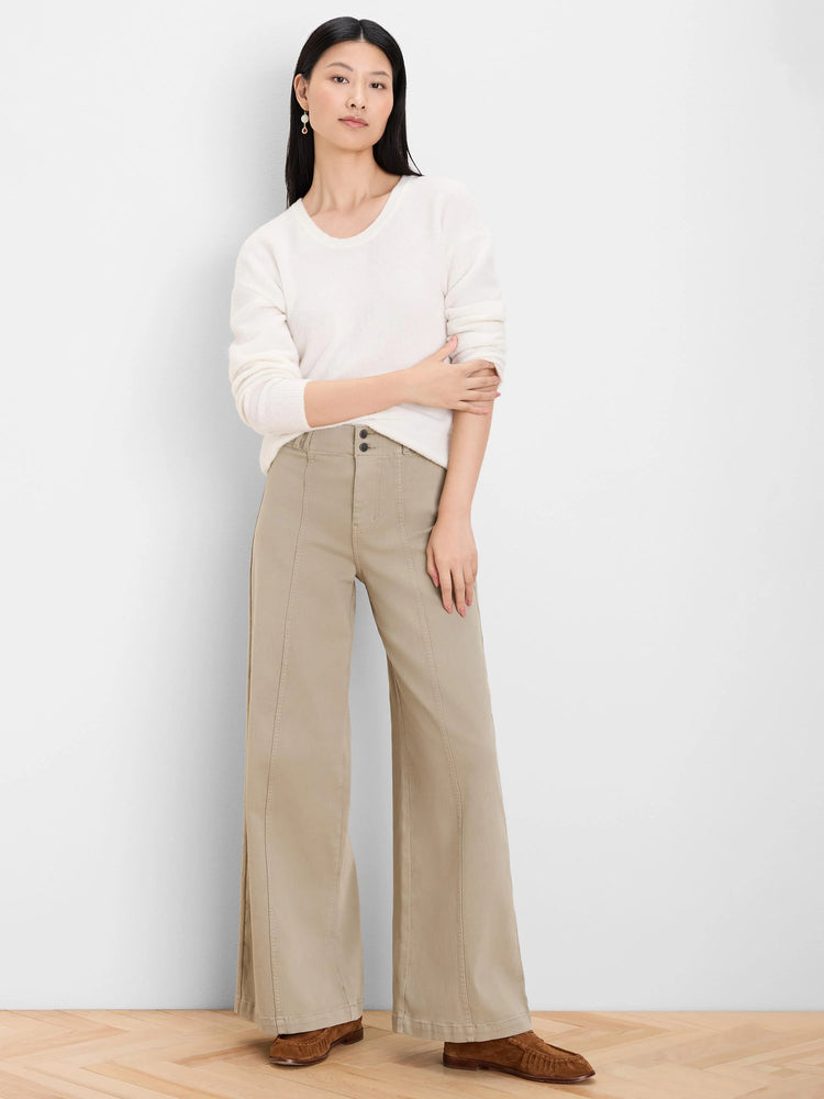 Off-white slouchy scoop neck sweater with a soft, fuzzy texture.