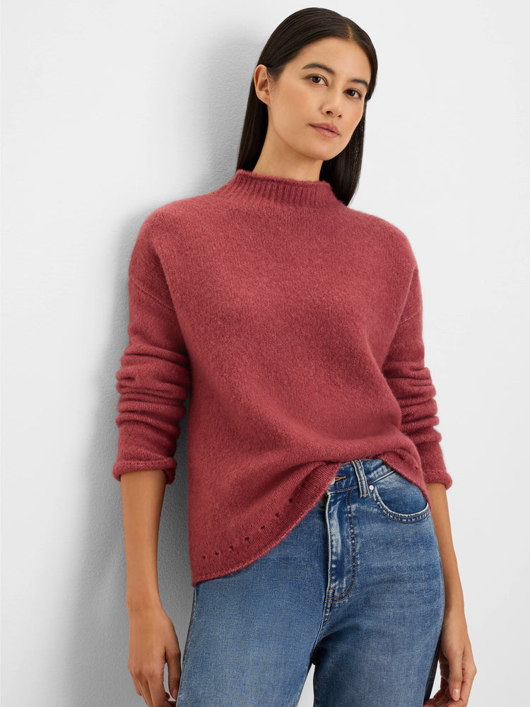 Muted rose mock neck sweater. Fuzzy knit texture, relaxed fit, long sleeves, with a perforated hem.