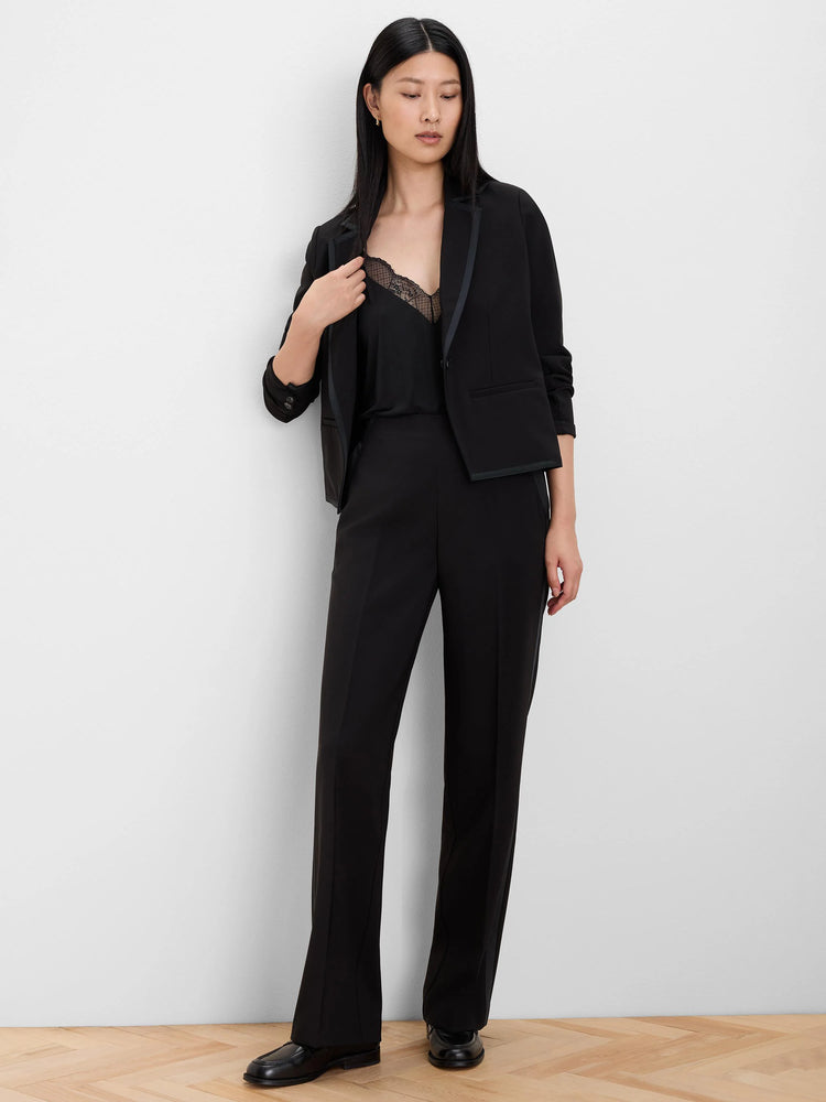 Black wide-leg pants with grosgrain trim down the outer side seams.