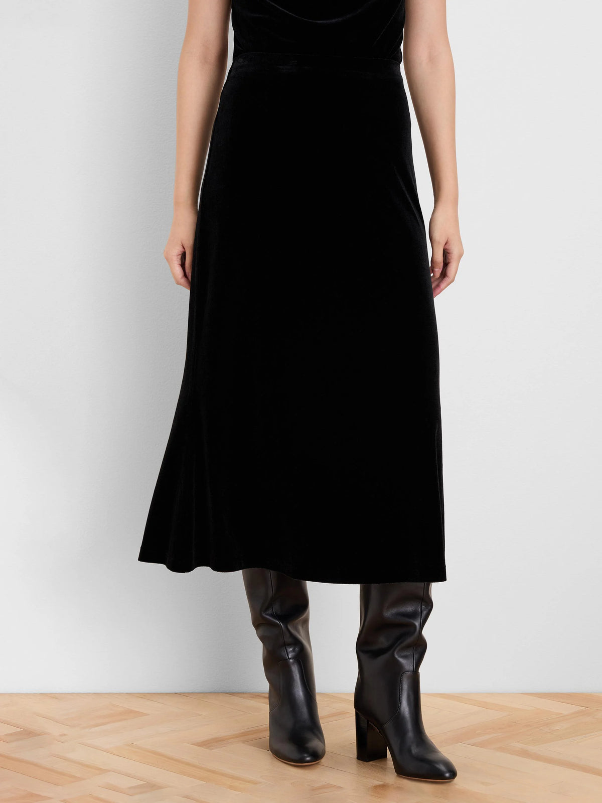Black velvet midi slip skirt with a subtle A-line flare.