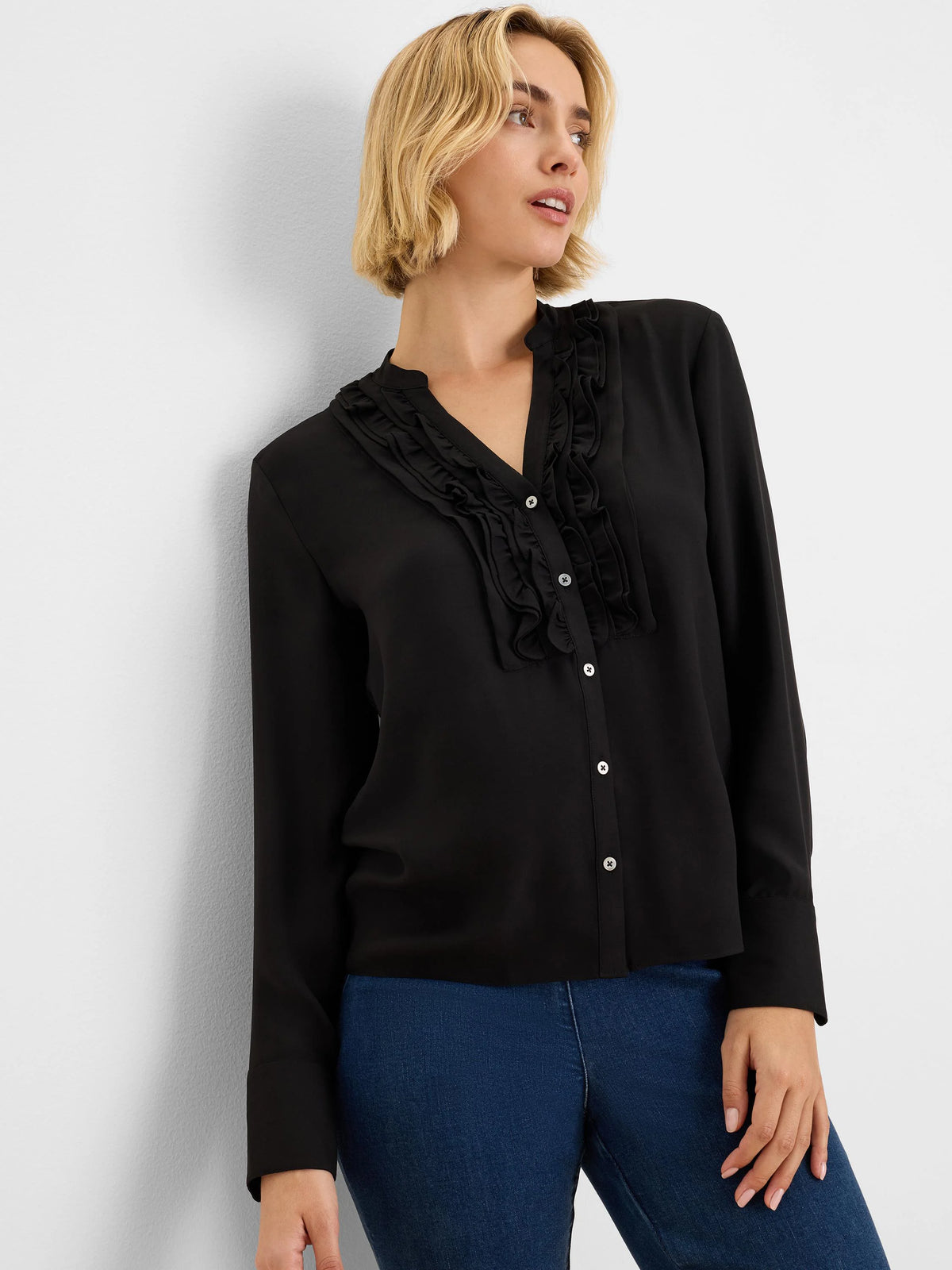 Black long-sleeve shirt with ruffles flanking the white button-front placket and a band collar.