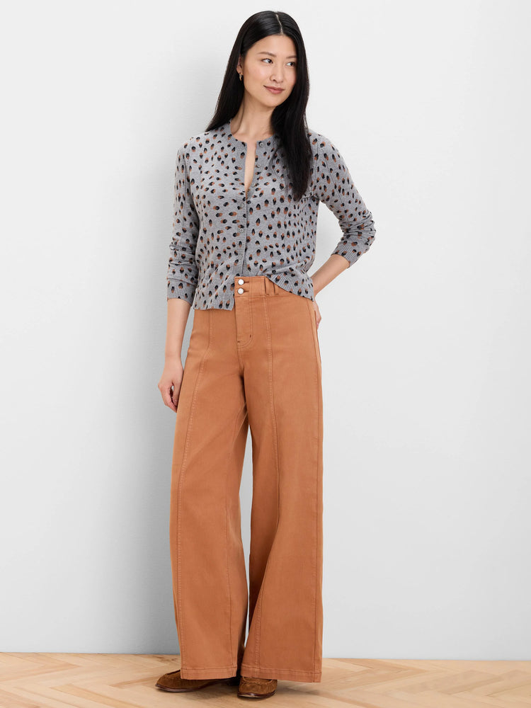 Rust wide leg jeans with prominent vertical front seams, featuring a high waist and two visible buttons.