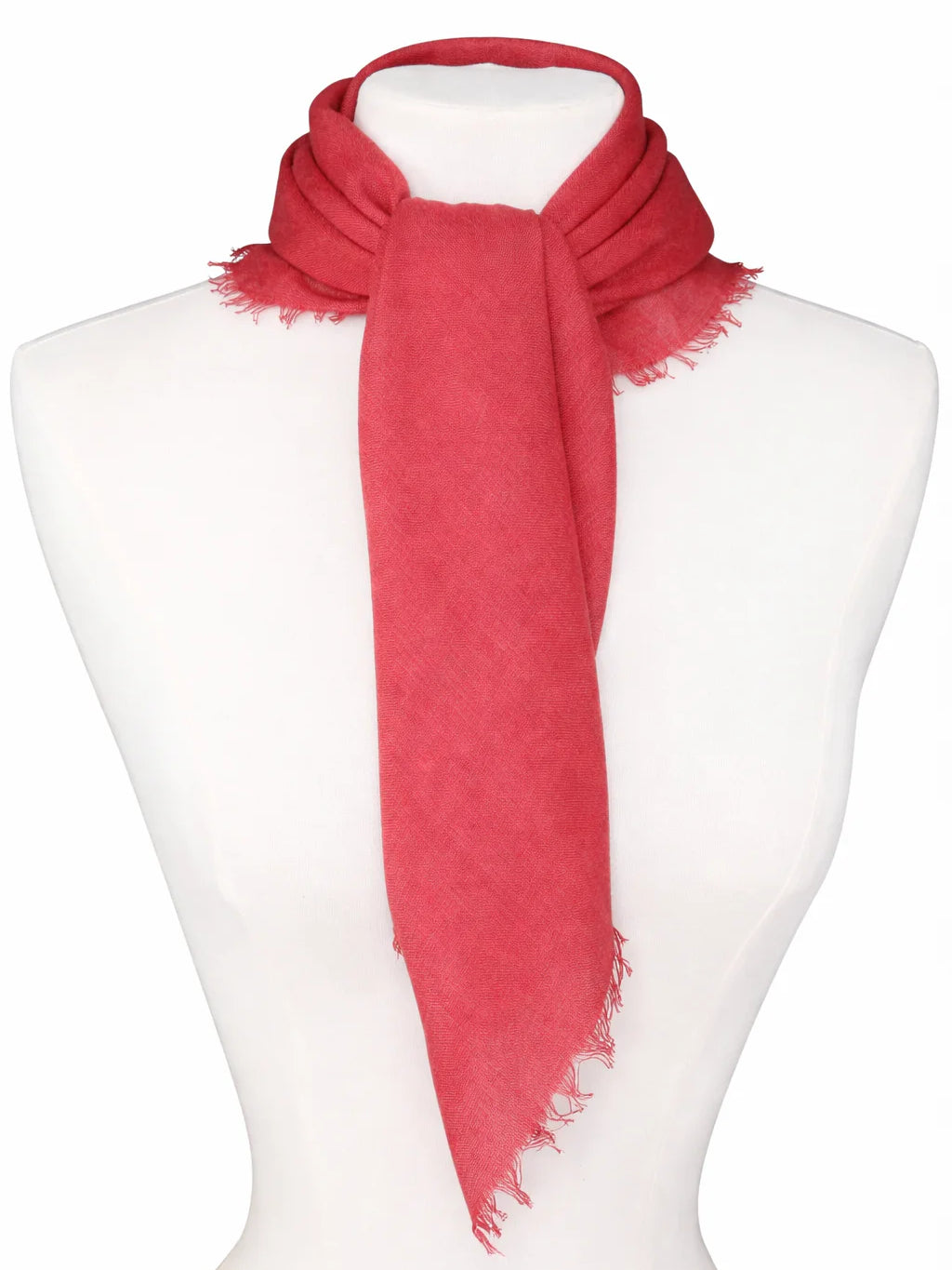 Muted red scarf with soft texture and fringed edges, tied around a mannequin's neck.