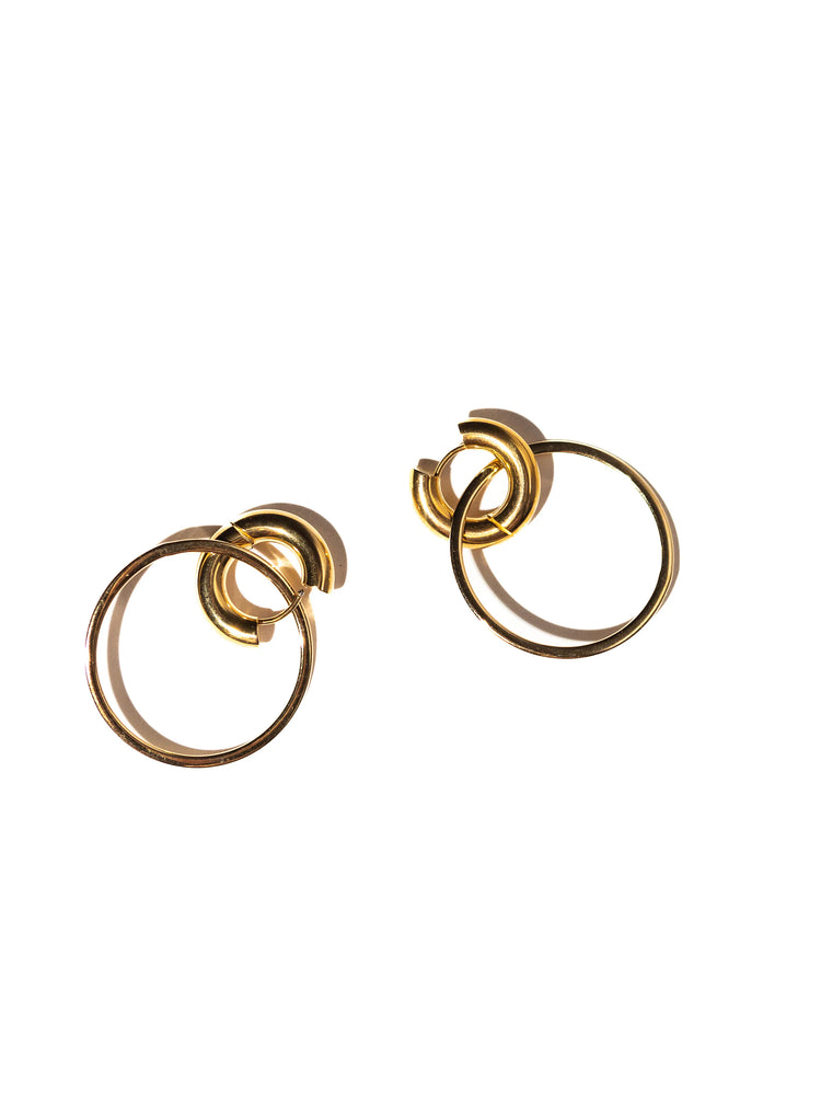 Gold two-tone hoop earrings;  smaller hoop overlaps a larger one.