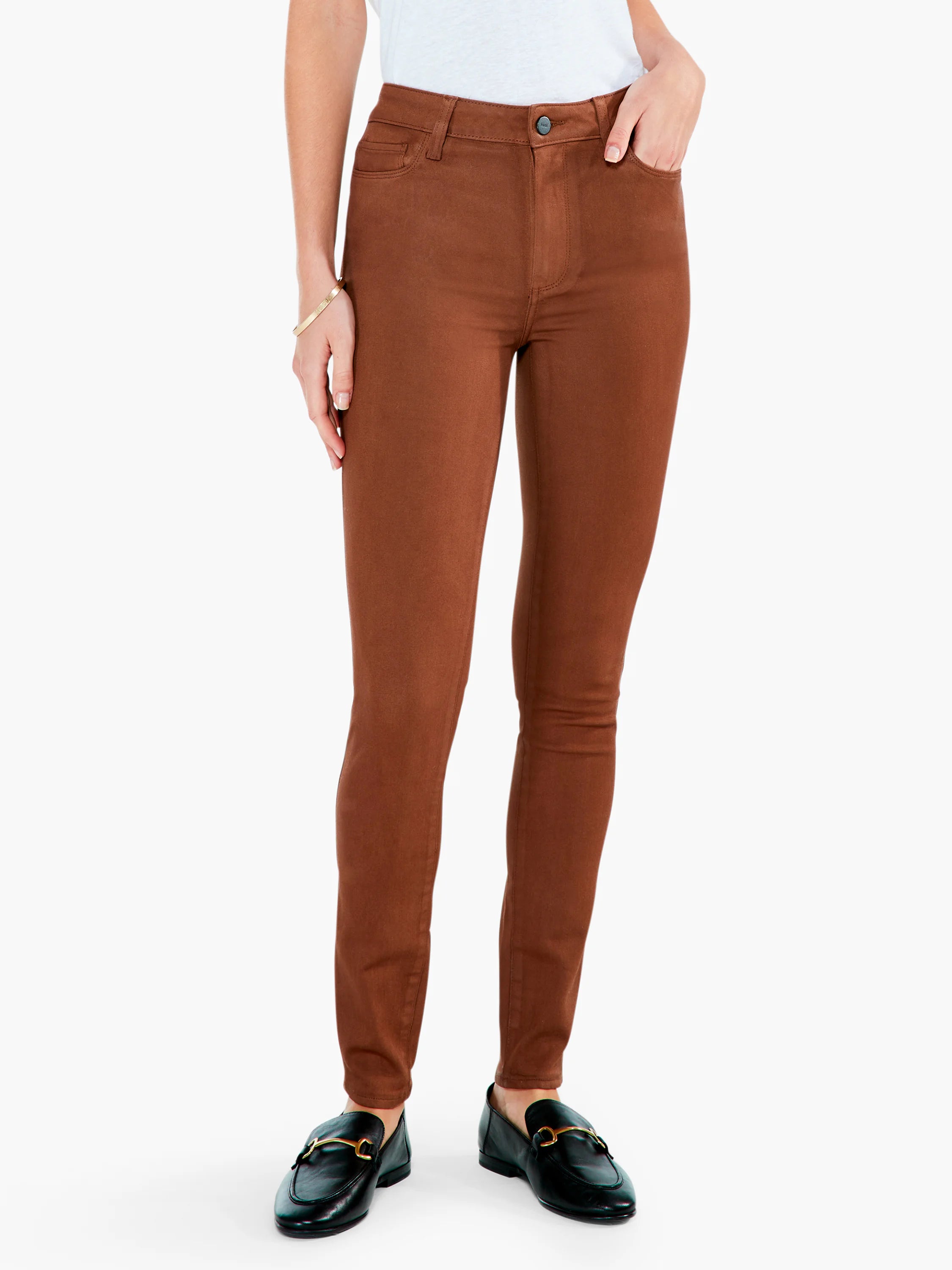 Rust brown slim-fit ankle pants. Features include a button closure, belt loops, and scoop front pockets.
