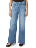 Light wash, wide-leg jeans with a high waist and frayed hems.  Model wears maroon flats.