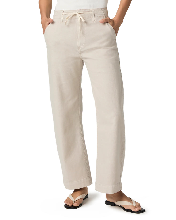 Light beige wide-leg ankle pants with drawstring tie waist and cuffed hems.