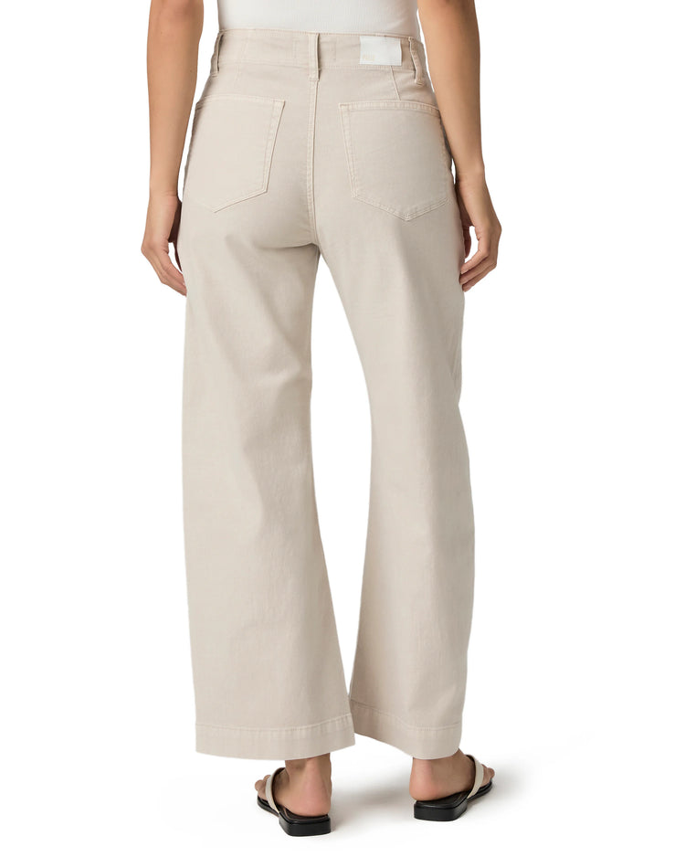 Back view of light beige wide-leg ankle pants with visible back pockets and a cuffed hem.