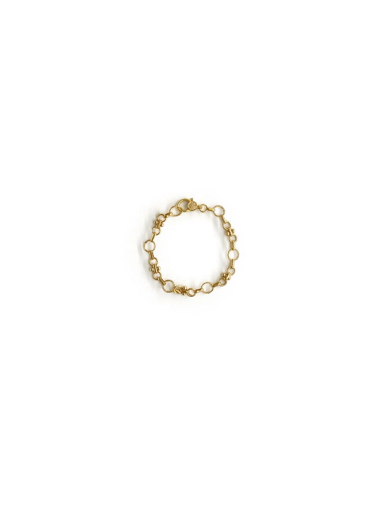 Gold bracelet; chain with small circles and textured links; clasp closure.