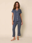 Here's alt text for the image, under 125 characters:

"Gray pajama set with white piping detail.  Short-sleeved top with...