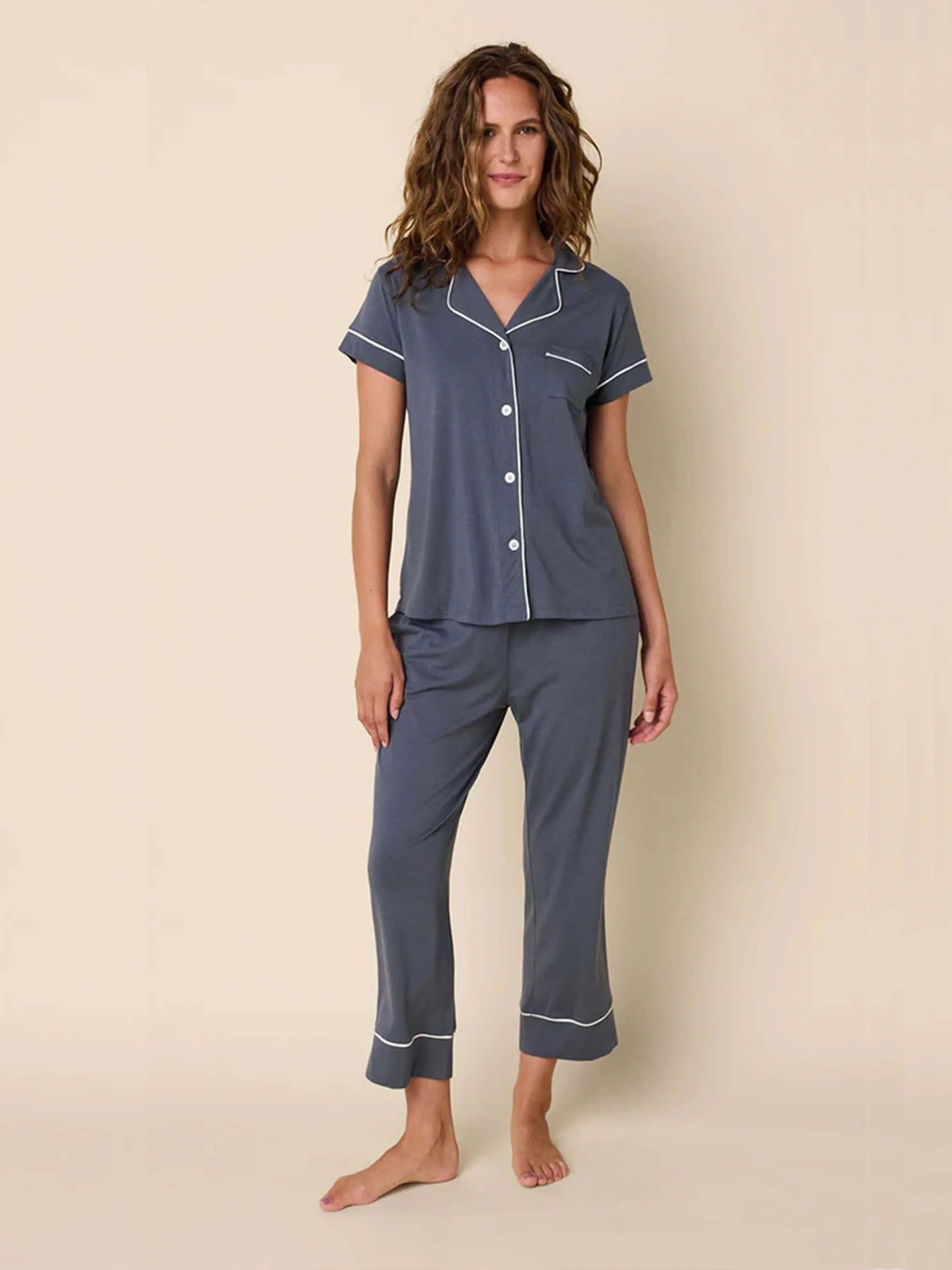 Here's alt text for the image, under 125 characters:

"Gray pajama set with white piping detail.  Short-sleeved top with...