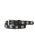 Black belt with a silver buckle and many round, ornate silver studs. The belt is coiled.