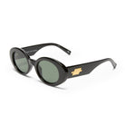 Black chunky oval sunglasses feature dark green lenses and a signature gold logo on the wide arms.
