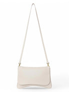 Off-white leather crossbody bag with long strap and gold clasps.