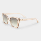 These oversized square sunglasses feature translucent peach frames with gradient lenses and gold temple accents.