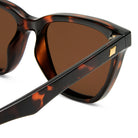 Tortoiseshell cat eye sunglasses feature brown lenses and gold square details on the temples for a chic flattering fit.