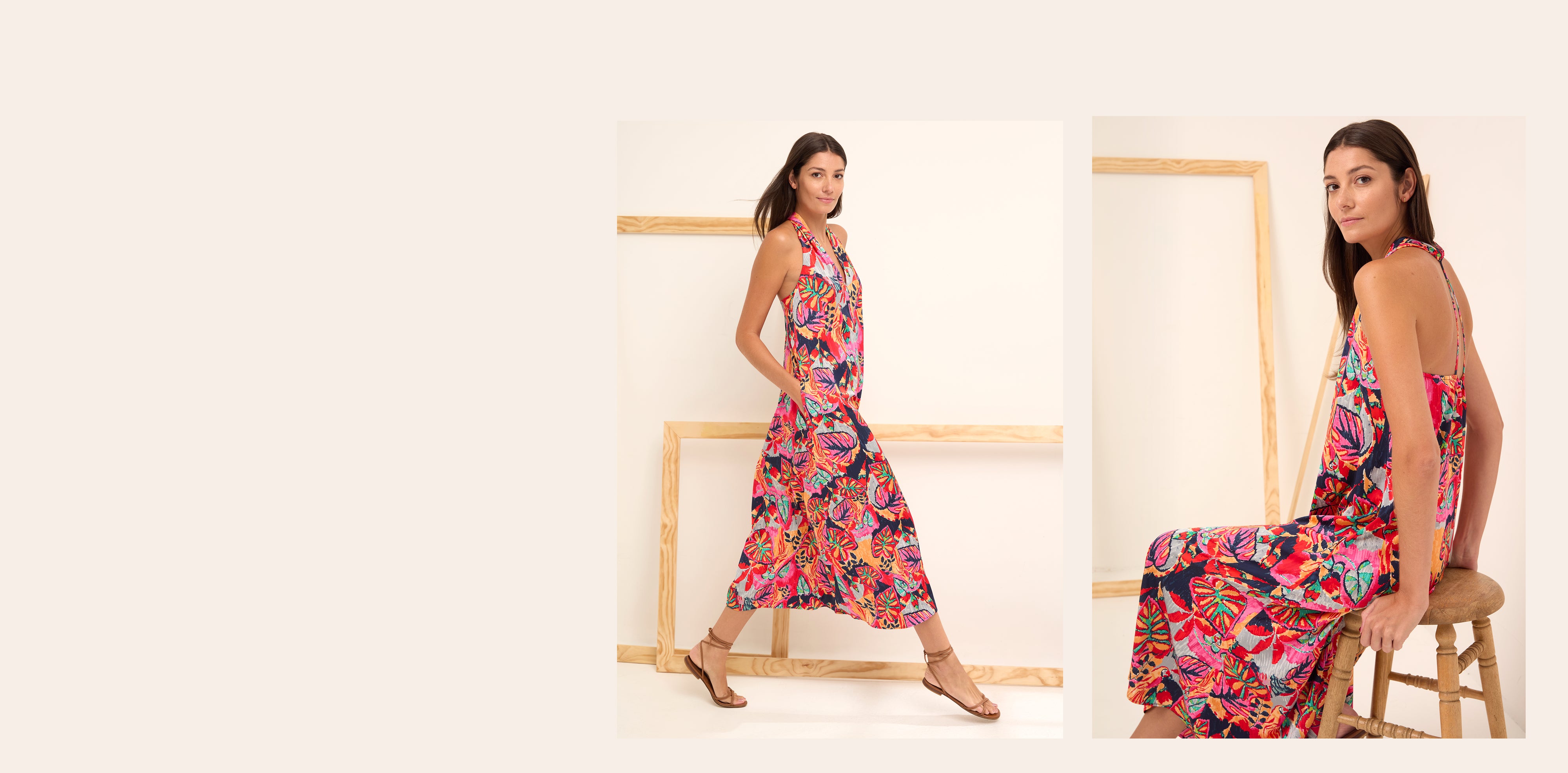 Woman wearing a colorful floral dress in a minimalistic setting
