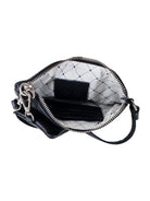Black leather pouch, silver zipper & hardware. Off-white interior w/diamond pattern.  Includes small interior pockets.