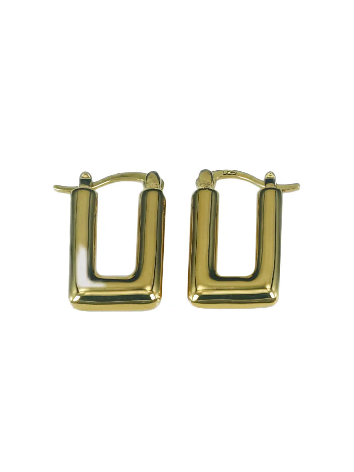 A pair of shiny gold small rectangular huggie hoop earrings.