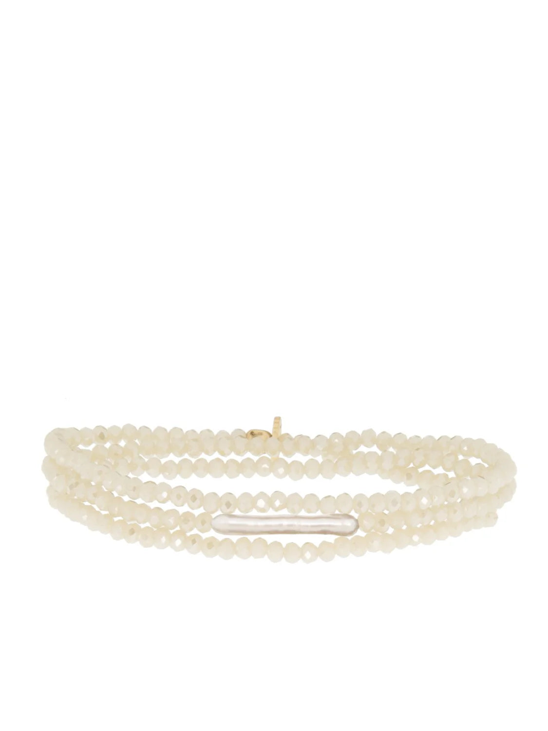 Cream faceted beads on a three-strand bracelet with a center elongated white pearl.