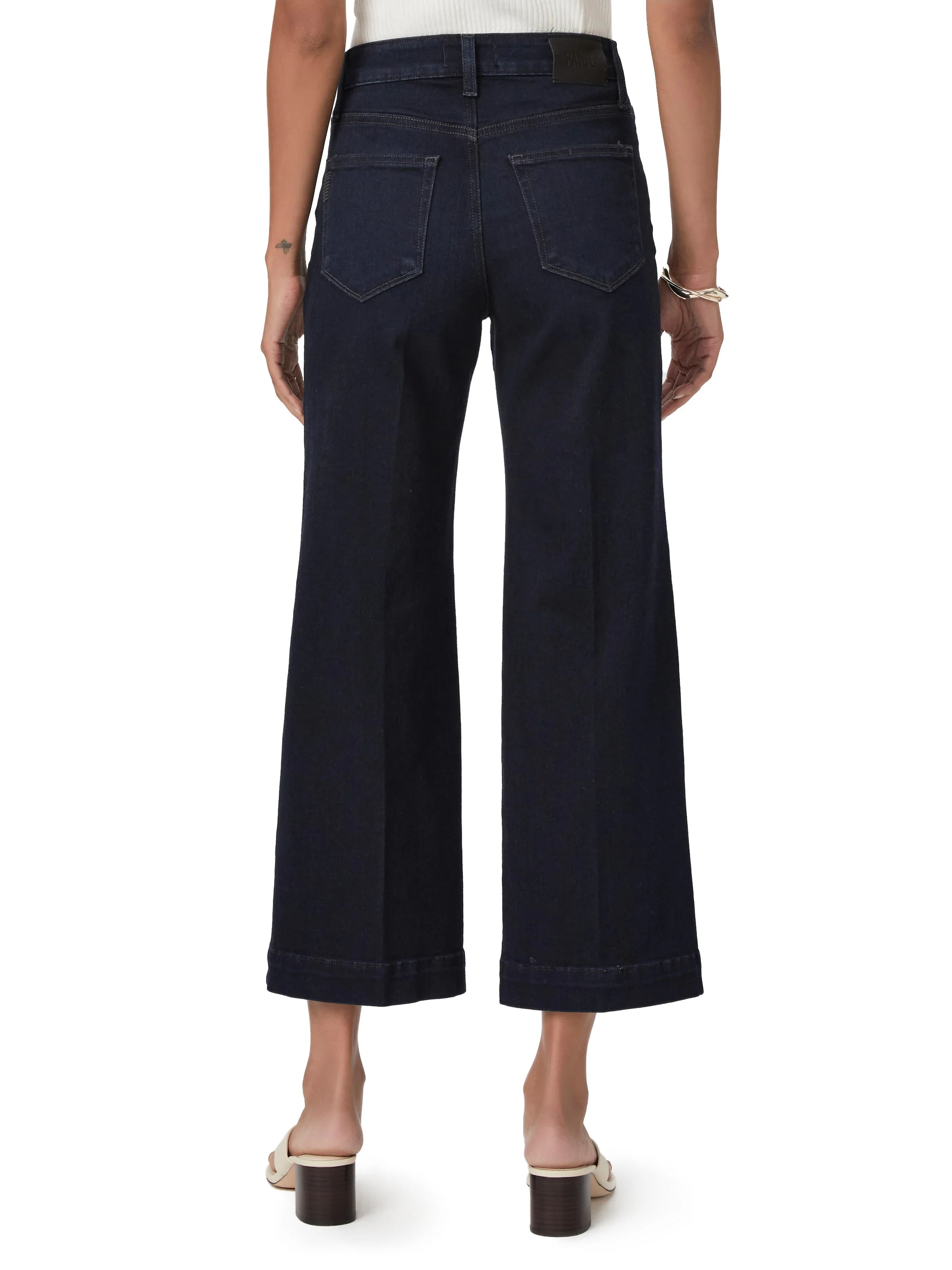 Dark wash, wide-leg cropped jeans; back view.
