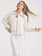 Off-white Julie jacket: cropped, collared, with front buttons & chest flap pockets.