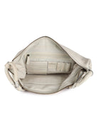 Off-white leather shoulder bag; braided leather handles, off-white interior with zipper closure and pockets.