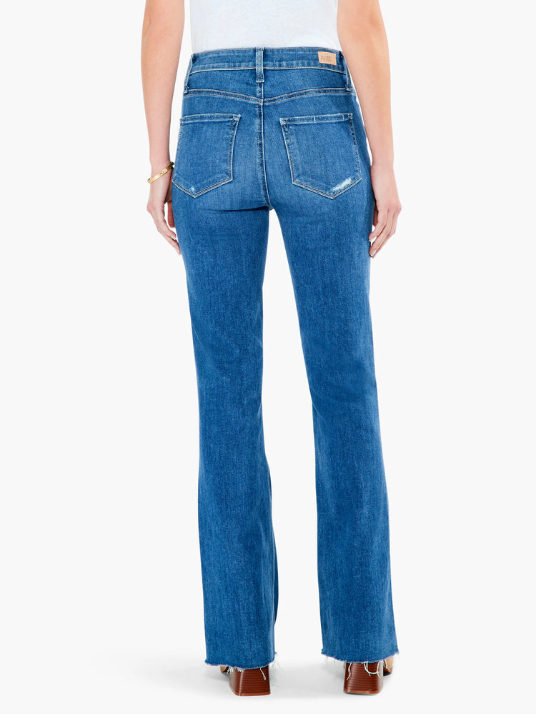 Here's alt text under 125 characters:

Mid-wash blue, high-rise flared jeans with raw hem.  Distressed details at back...