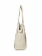 Off-white tote bag with two top handles and a zipper closure.  Textured pebbled leather.